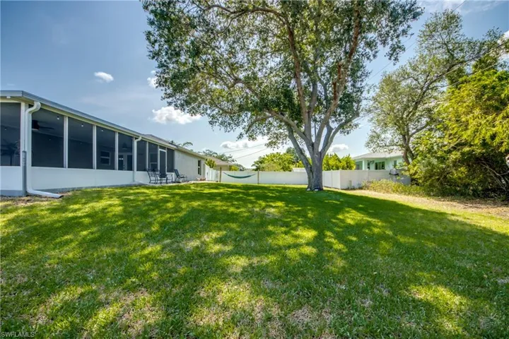 View of yard featuring a sunroom