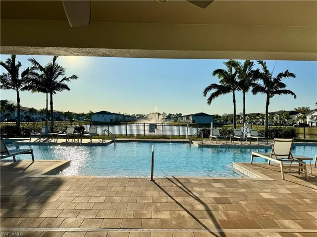 Community pool featuring a patio