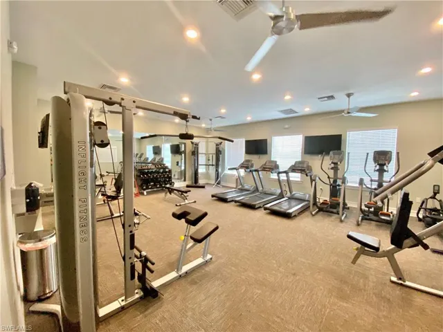 Workout area featuring recessed lighting