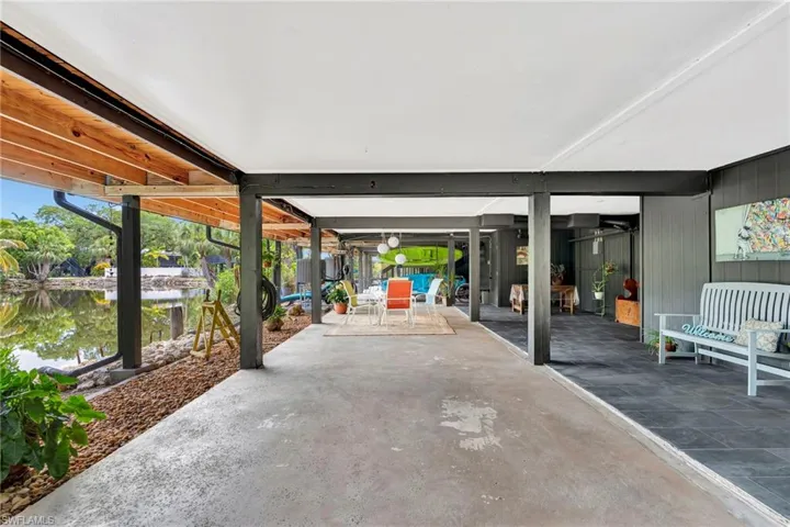 Large carport with multiple uses  Furnished with two 10' kayaks & ladies bike.