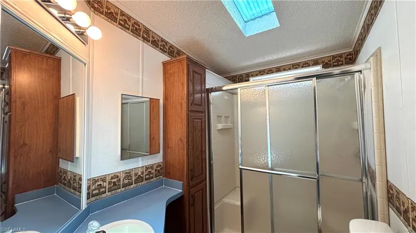 Guest Bathroom features a Shower/Tub combination and skylight for lots of natural light.