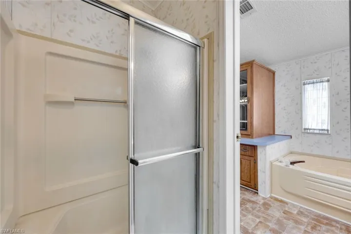 Primary Bathroom has a separate tub and handicap full shower.