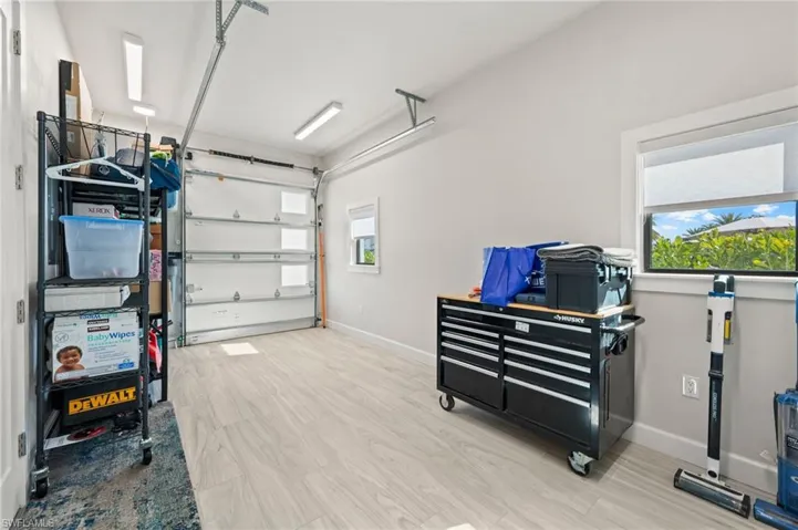 Garage featuring baseboards