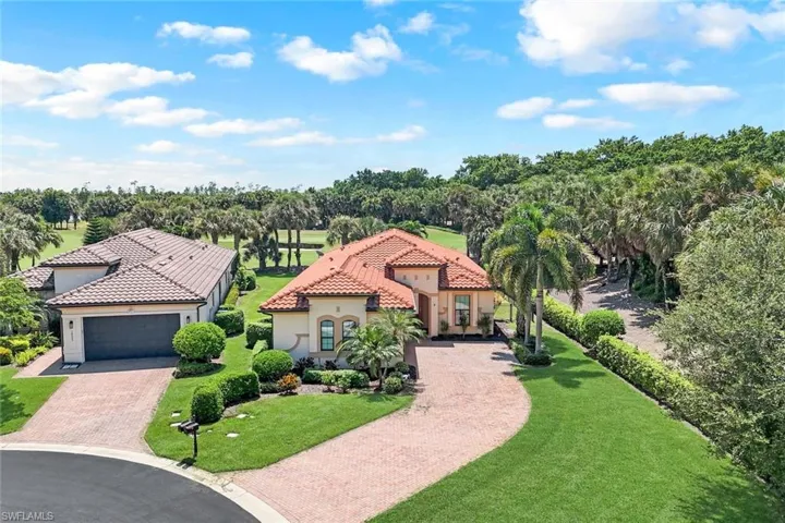 Mediterranean / Spanish-style house with a 2 car garage