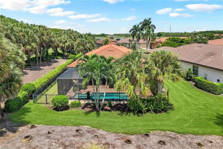 View of swimming pool with spa, lanai and lawn