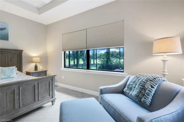 Primary bedroom featuring a view of the golf course