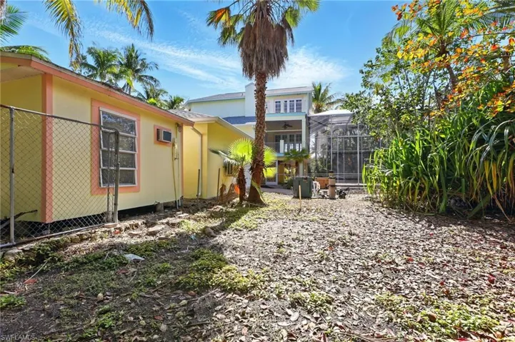 Rear view of house featuring stucco siding
