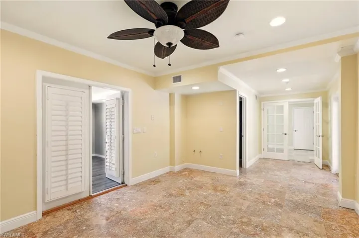 Unfurnished bedroom featuring ornamental molding, recessed lighting, french doors, baseboards, and access to outside