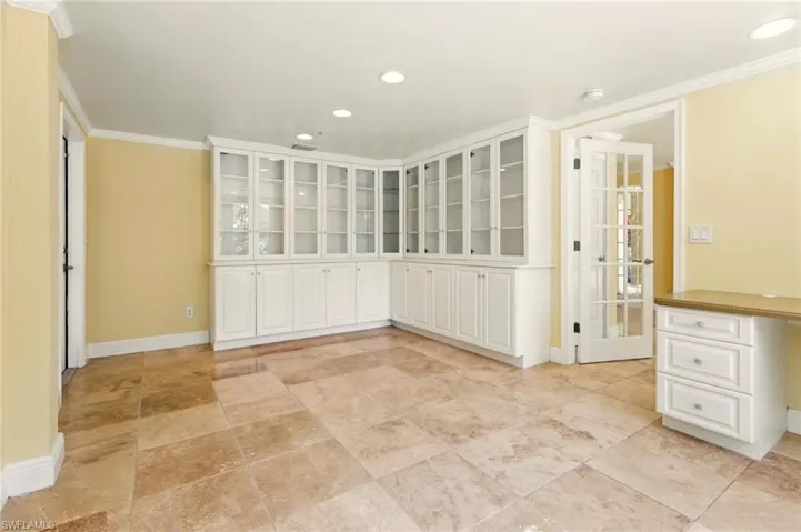 Unfurnished room with baseboards, recessed lighting, crown molding, and a smoke detector