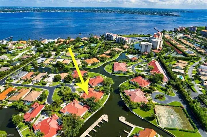 Birds eye view of property featuring a water view