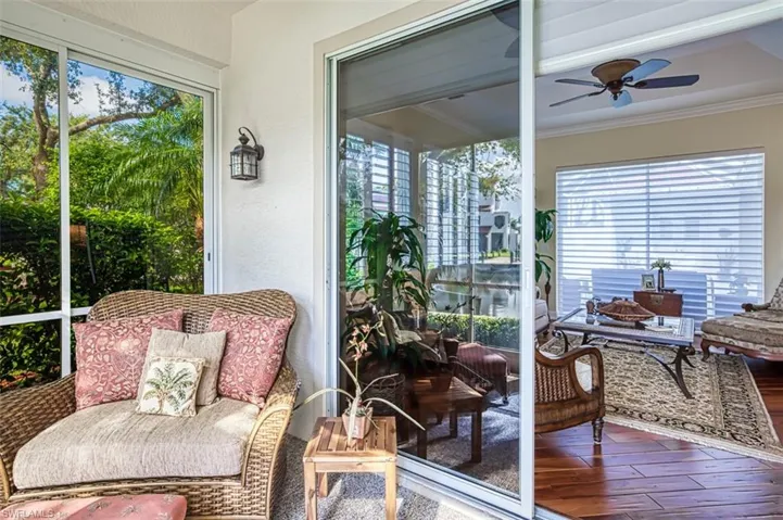 Sunroom with a healthy amount of sunlight and ceiling fan