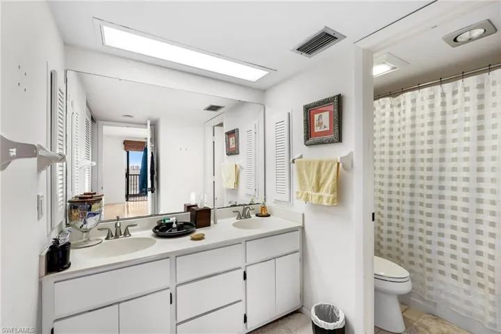 Guest bathroom with dual vanity & tub/shower combo