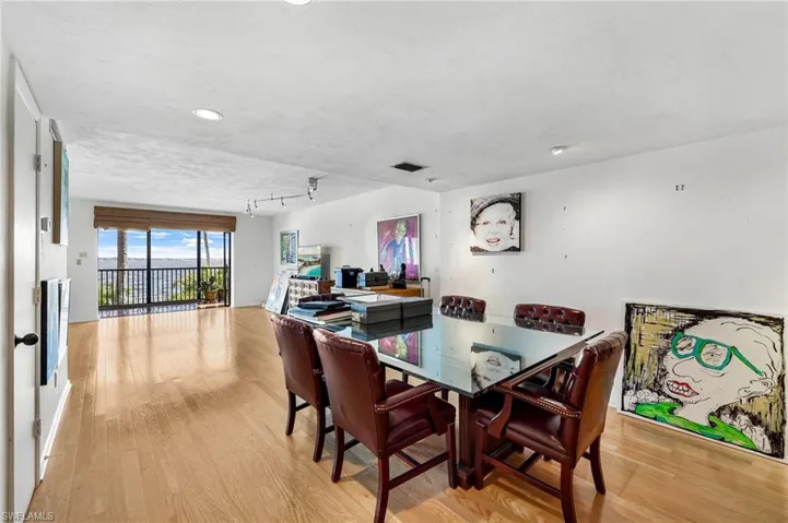 A massive waterfront dining room / living room. With room for another dining table on the lanai