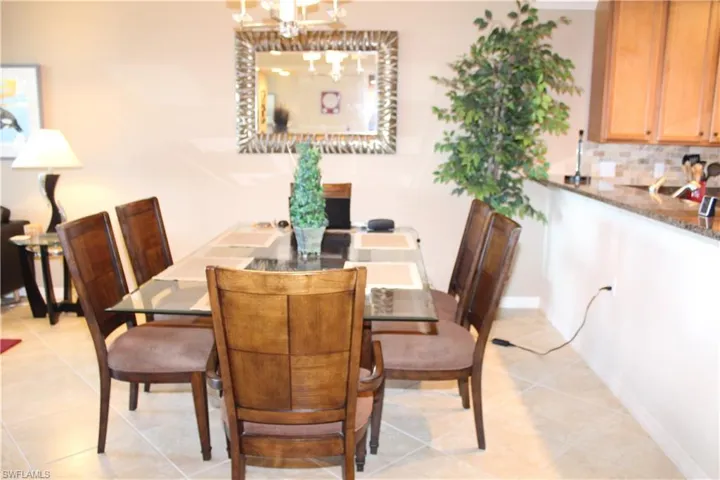 Dining area featuring light tile patterned flooring