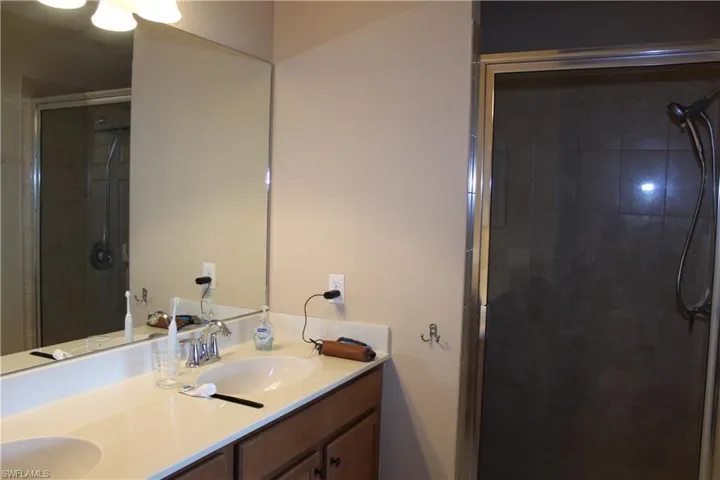 Master Full bath with a shower stall and double vanity