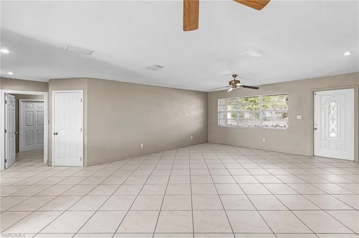 Unfurnished living room featuring recessed lighting, a ceiling fan, and light tile patterned floors