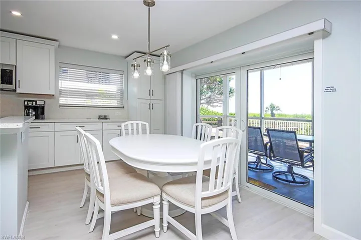 Dining room with light and recessed lighting