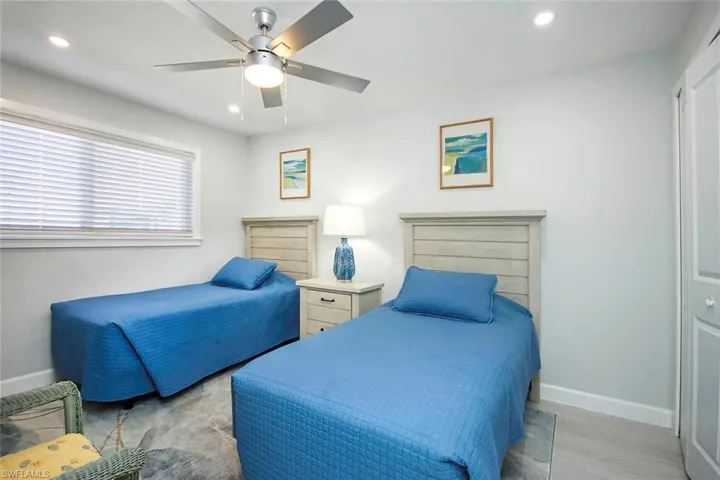 Bedroom featuring recessed lighting, ceiling fan, a closet, and light wood-type flooring