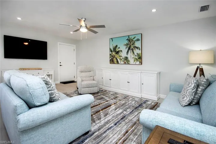 Living area featuring recessed lighting and ceiling fan