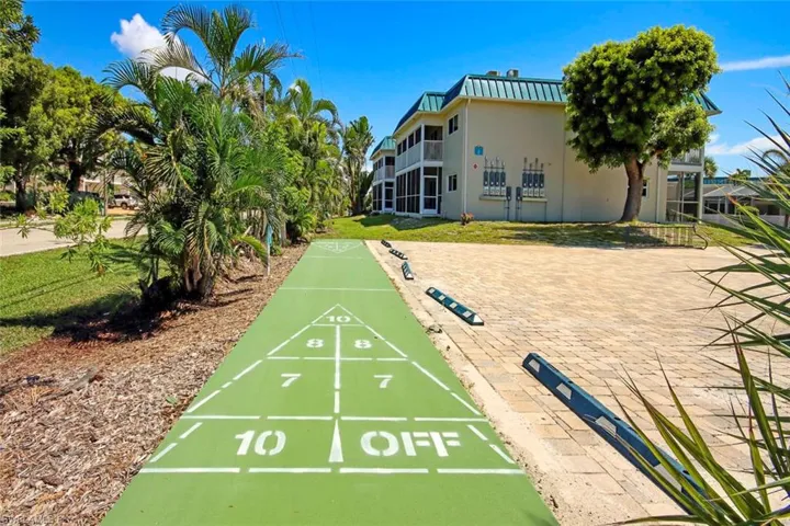 View of home's community with shuffleboard