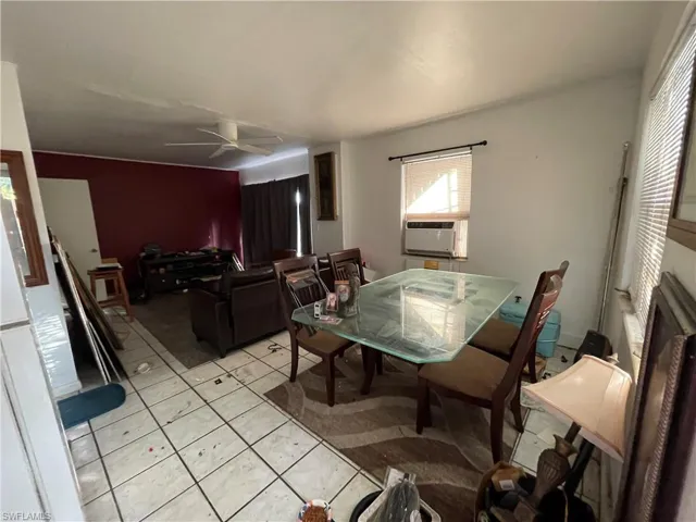 Unit 2: Tiled dining space with cooling unit and ceiling fan