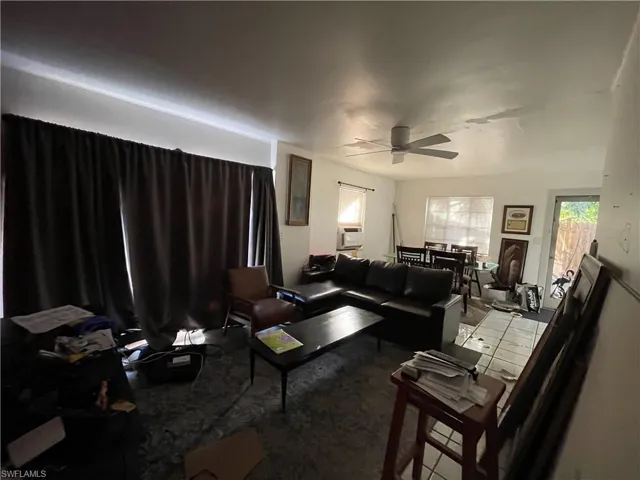 Unit 2: Living room with ceiling fan and cooling unit