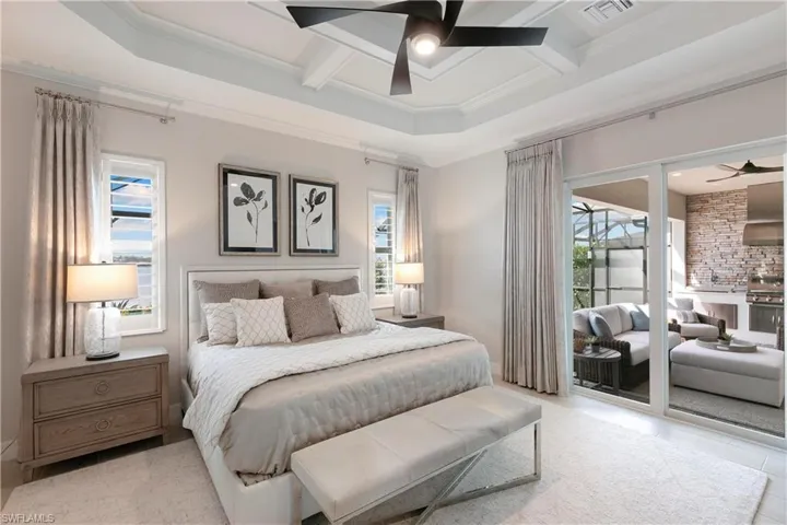 Large master bedroom with lake & pool views, and ensuite bathroom