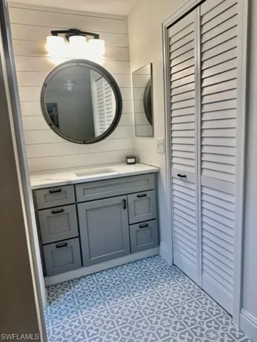 Bathroom with vanity and tile patterned floors