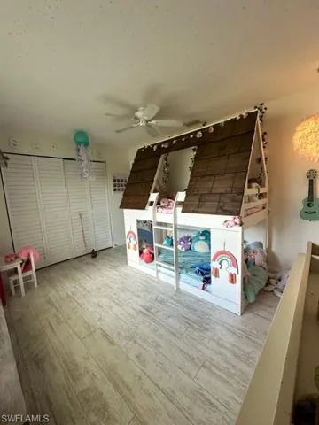 Unfurnished bedroom featuring light hardwood / wood-style flooring and ceiling fan
