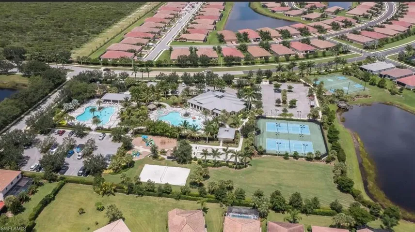 View of property location featuring a nearby body of water and nearby suburban area