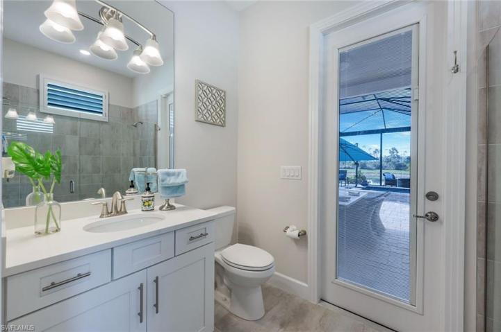 Bathroom #3 is not only an ensuite bath, but also serves as a pool bath and includes a walk-in, frameless shower.