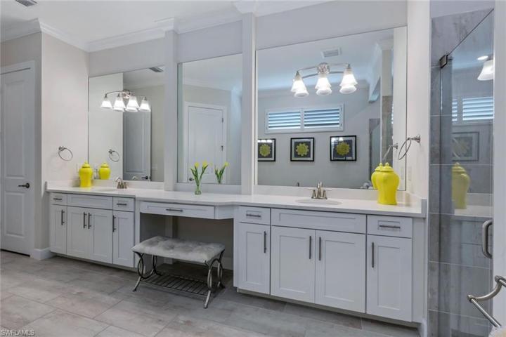 You'll love all of this cabinet and counter space in the owner bath.