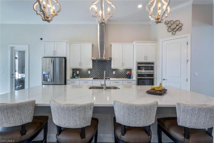 The oversize island makes the kitchen an ideal gathering space for guests.