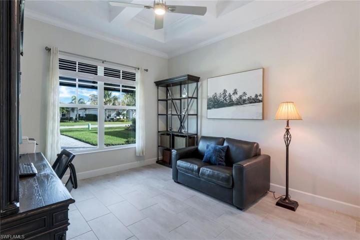 Located at the front of the home, this den (or optional fourth bedroom) features a beautiful coffered ceiling, crown molding, plenty of light, and a large closet!