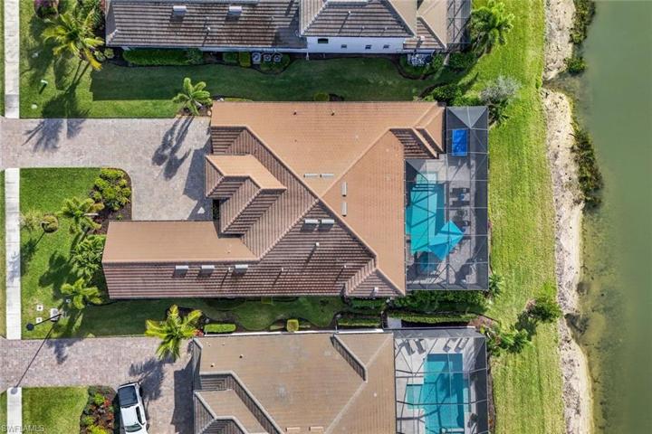 This oversize lot allows enough space for an extra long driveway, and extended outdoor living space, while also providing fabulous views and plenty of privacy with mature calusa surrounding the outdoor living area.
