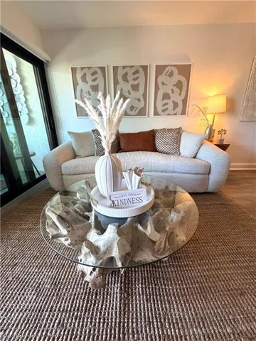 Living room featuring baseboards and wood finished floors