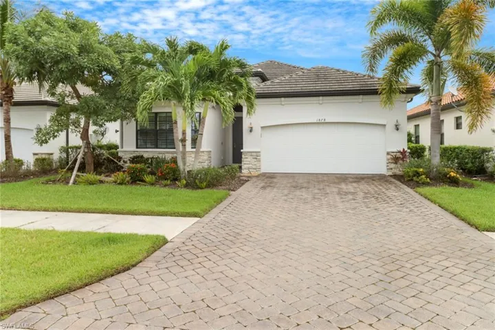 View of front of property with beautiful landscaping