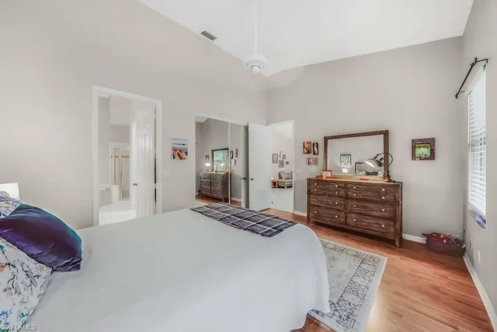 Bedroom featuring light wood-style floors and baseboards