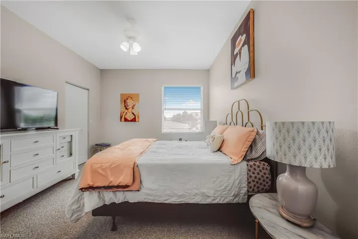 Bedroom featuring carpet flooring and ceiling fan