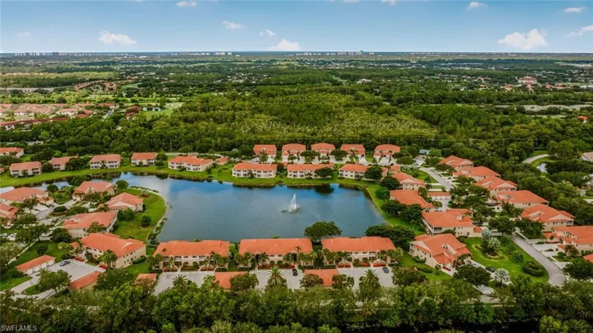 Aerial overview of property's location with a large body of water and nearby suburban area