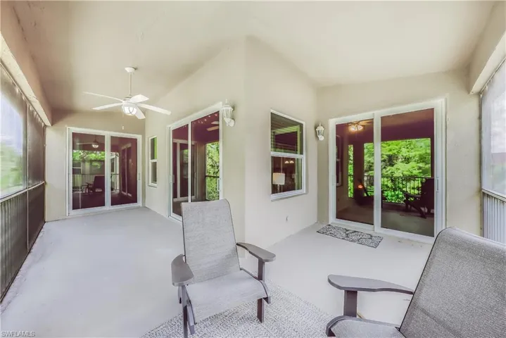 Sunroom / solarium featuring ceiling fan and plenty of natural light