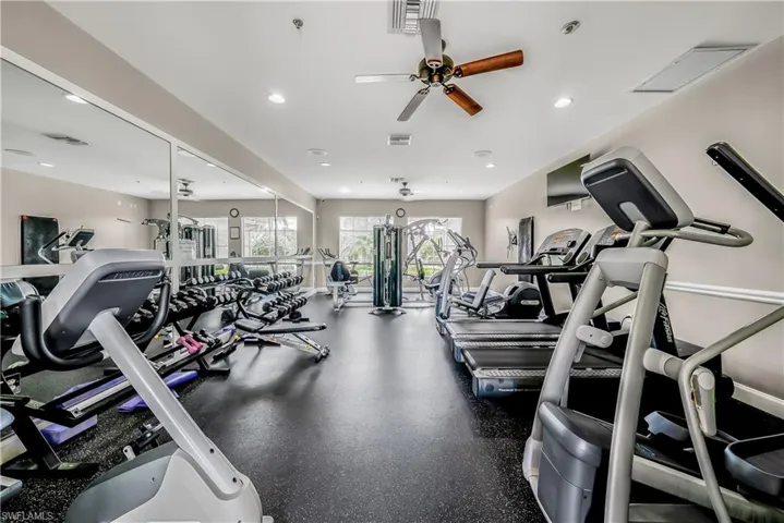 Exercise room with ceiling fan and recessed lighting