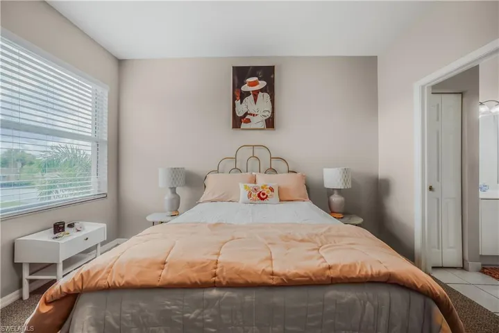 Bedroom with baseboards and carpet flooring