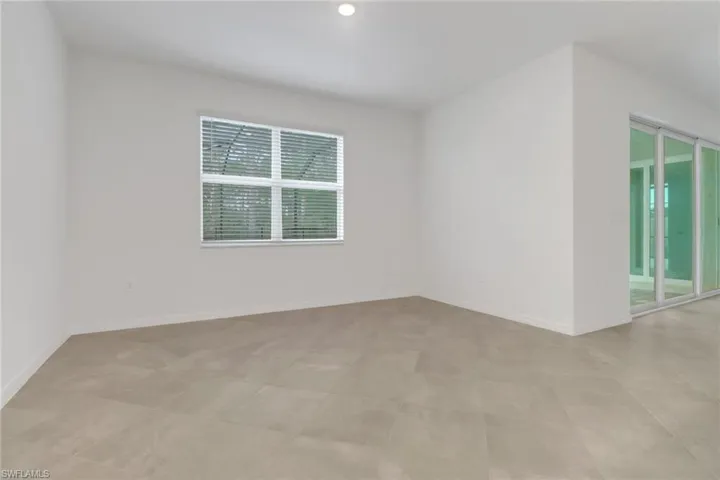 Unfurnished room with baseboards