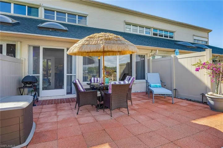 View of patio / terrace with area for grilling, outdoor dining space, and a sunroom
