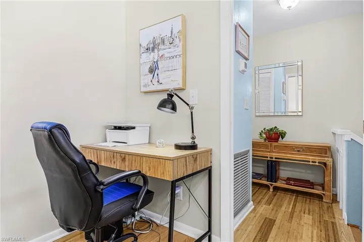 Office area with wood finished floors and baseboards
