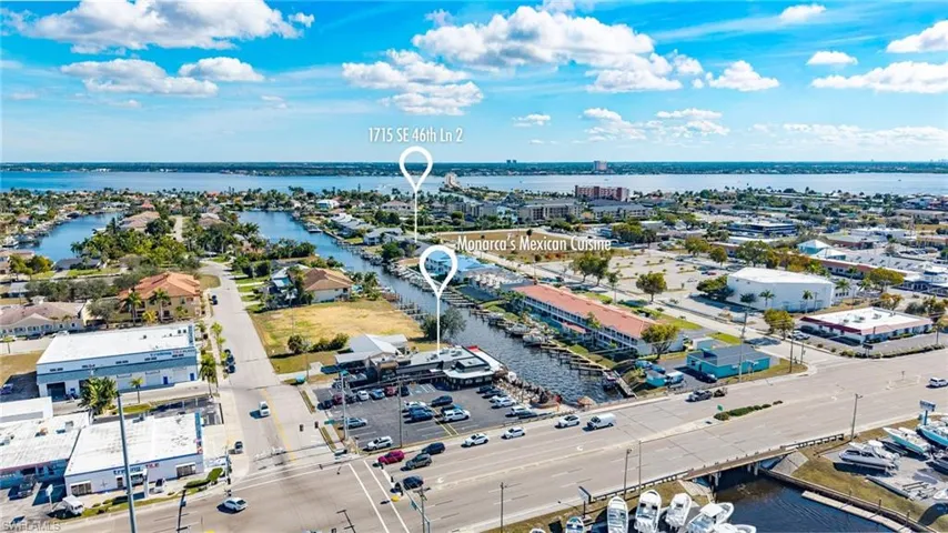Drone / aerial view of a nearby body of water and a notable bridge