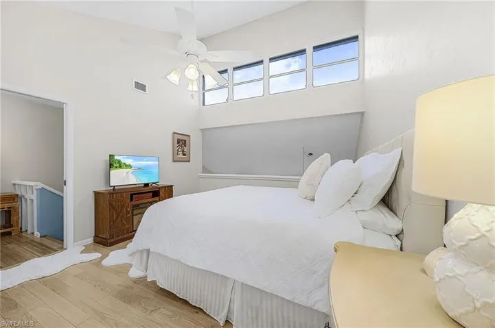 Bedroom with wood finished floors and ceiling fan