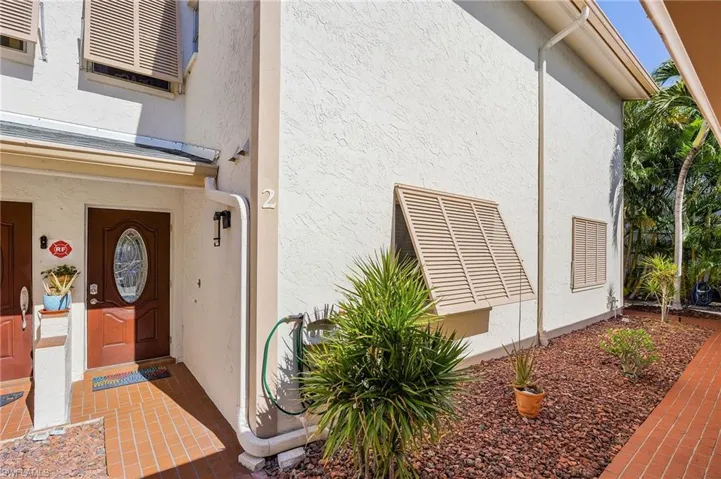 View of exterior entry with stucco siding