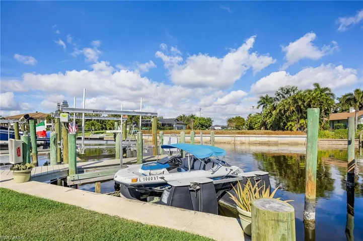 Dock with a water view and boat lift